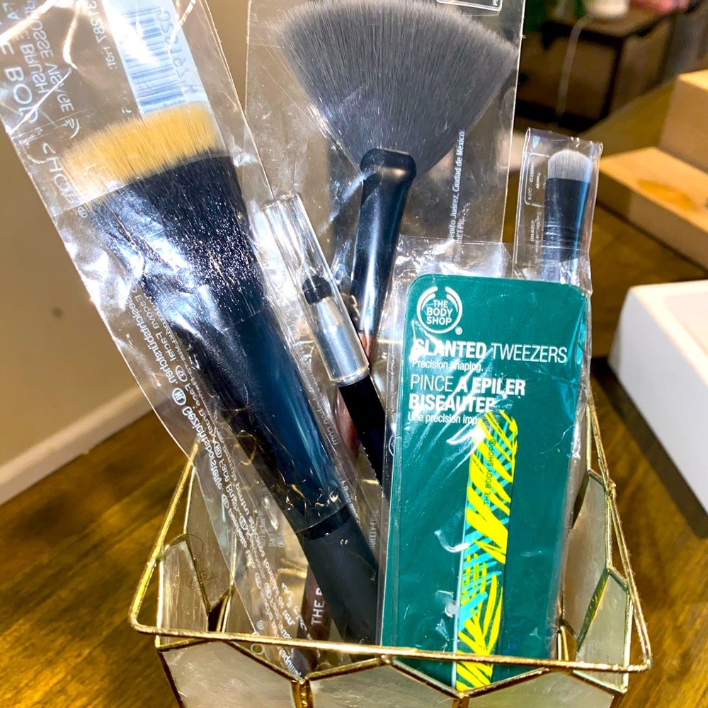 Assorted makeup brushes and eye liner new unused